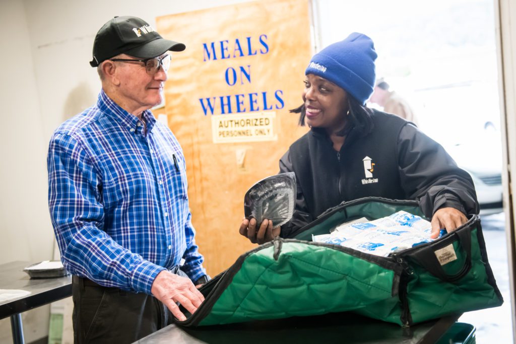 Meals on Wheels volunteers prepare for delivery route