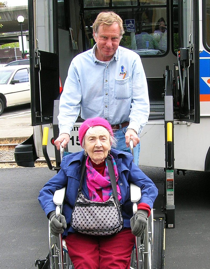Elderly Woman in wheelchair receives ride