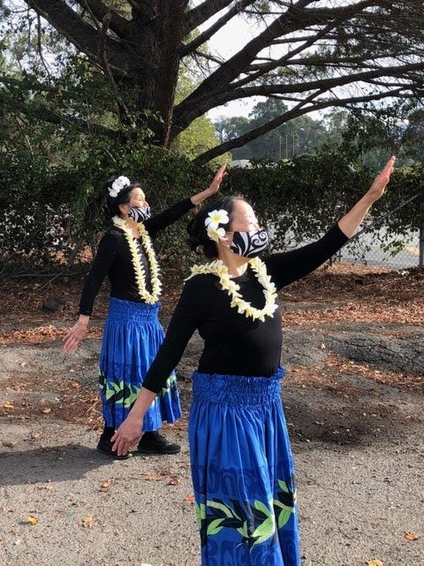 hula dancer wearing a face mask